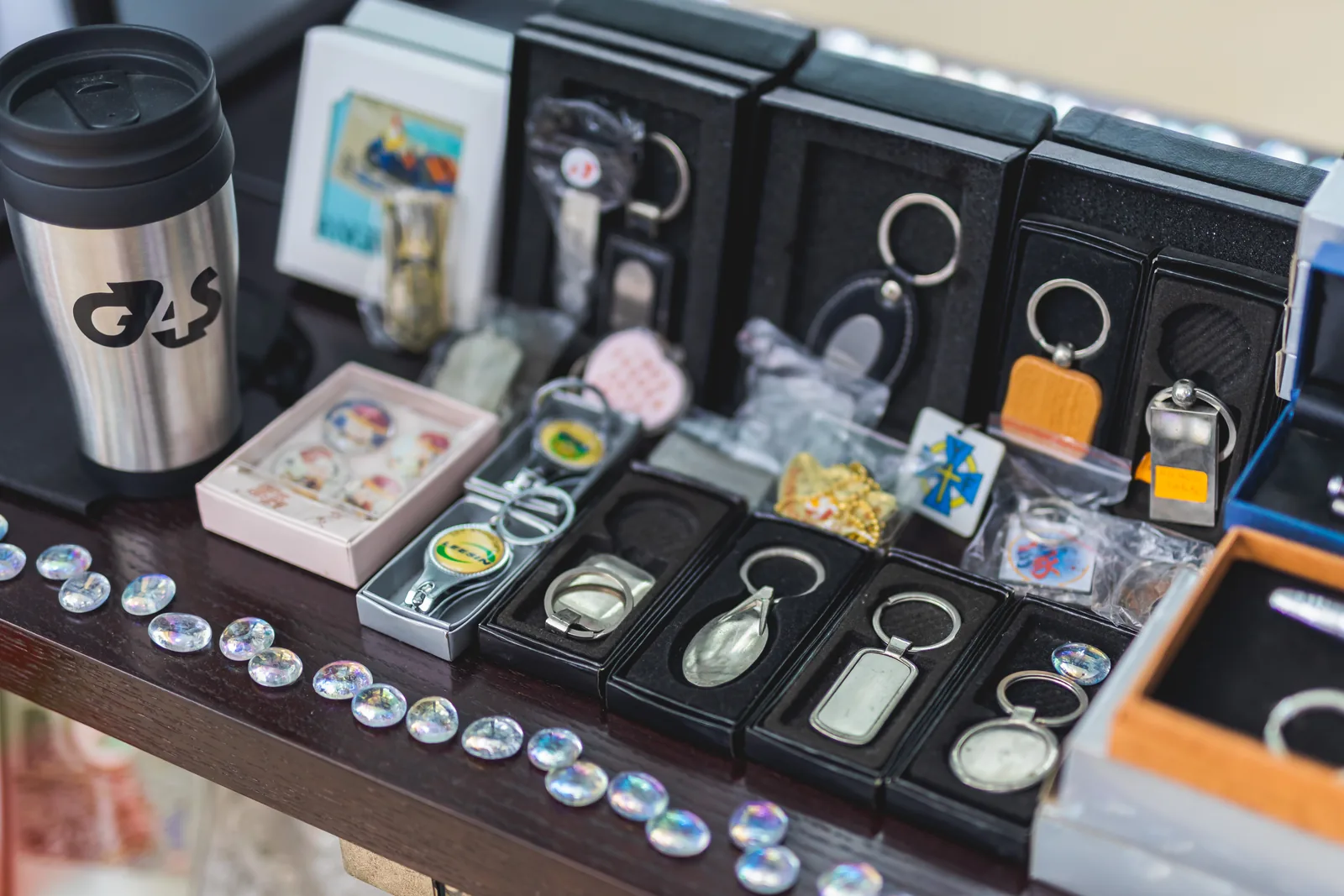 A display of branded drinkware, key rings and keepsakes
