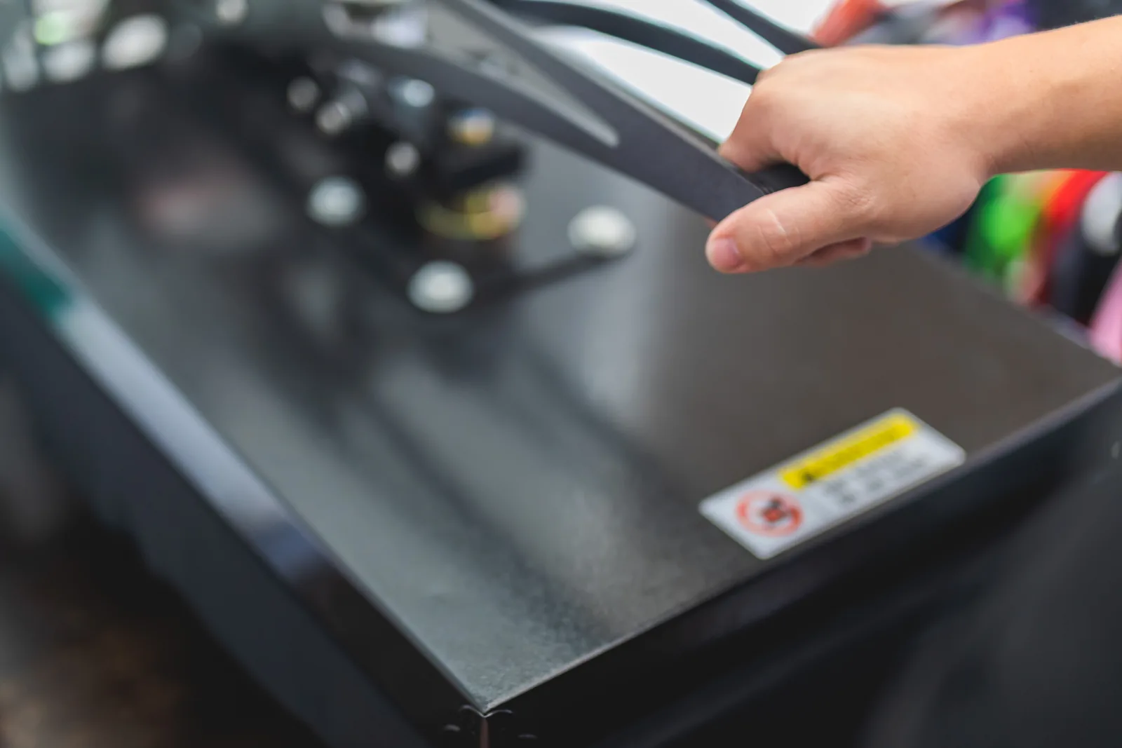A heat press being operated